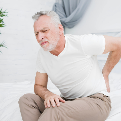 Elderly man experiencing hip pain