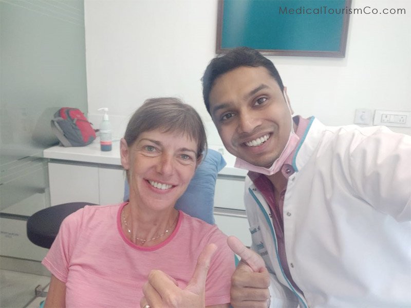 Patient smiling with Dr. Shashi Bhushan, Dentist