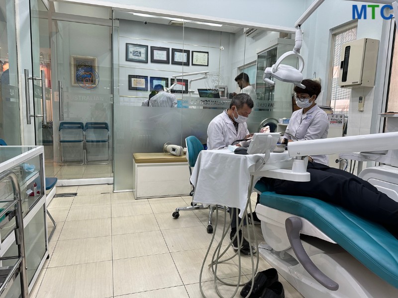 Doctors in Australian Dental Clinic in Hanoi working on patients.