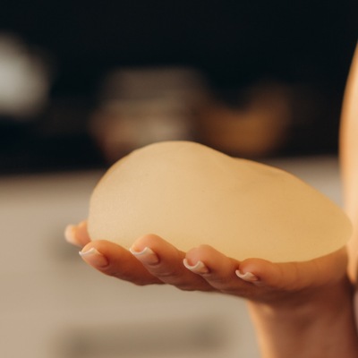 Person holding a gel breast implant