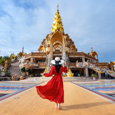 Woman standing at Wat Phra That Pha Son Kaew Temple