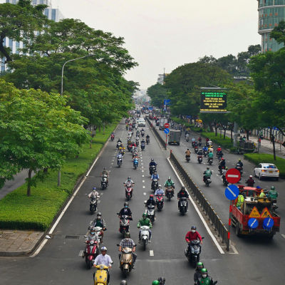 Motorbikes on a busy road in Ho Chi Minh City, Vietnam