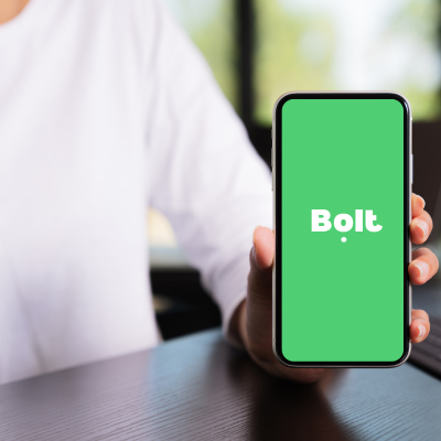 a person holding a phone with the bolt app open