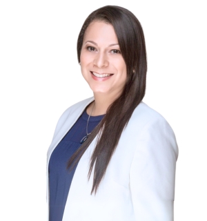 Dr. Laura Masis Pena in a white coat smiling against a white background