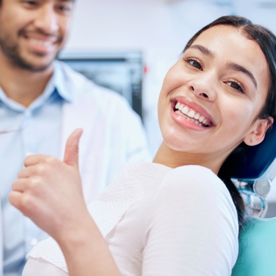 A happy patient after the dental veneers treatment