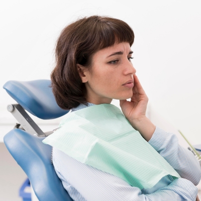 A patient suffering from dental pain waiting for the dentist